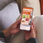 A person shopping on Amazon on their phone