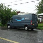 An Amazon delivery truck parked on a street.