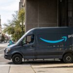 An Amazon delivery vehicle in a city