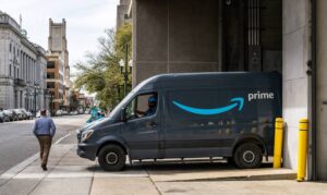 An Amazon delivery vehicle in a city
