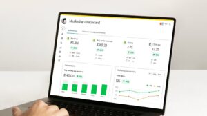 An open laptop that’s on a marketing dashboard screen