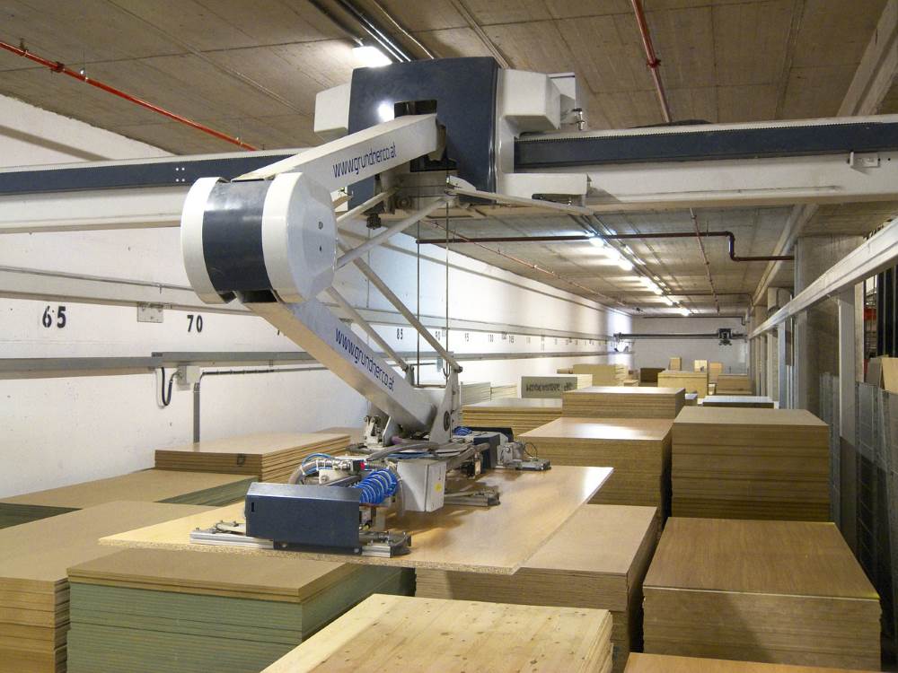 A robotic arm moving items in a warehouse