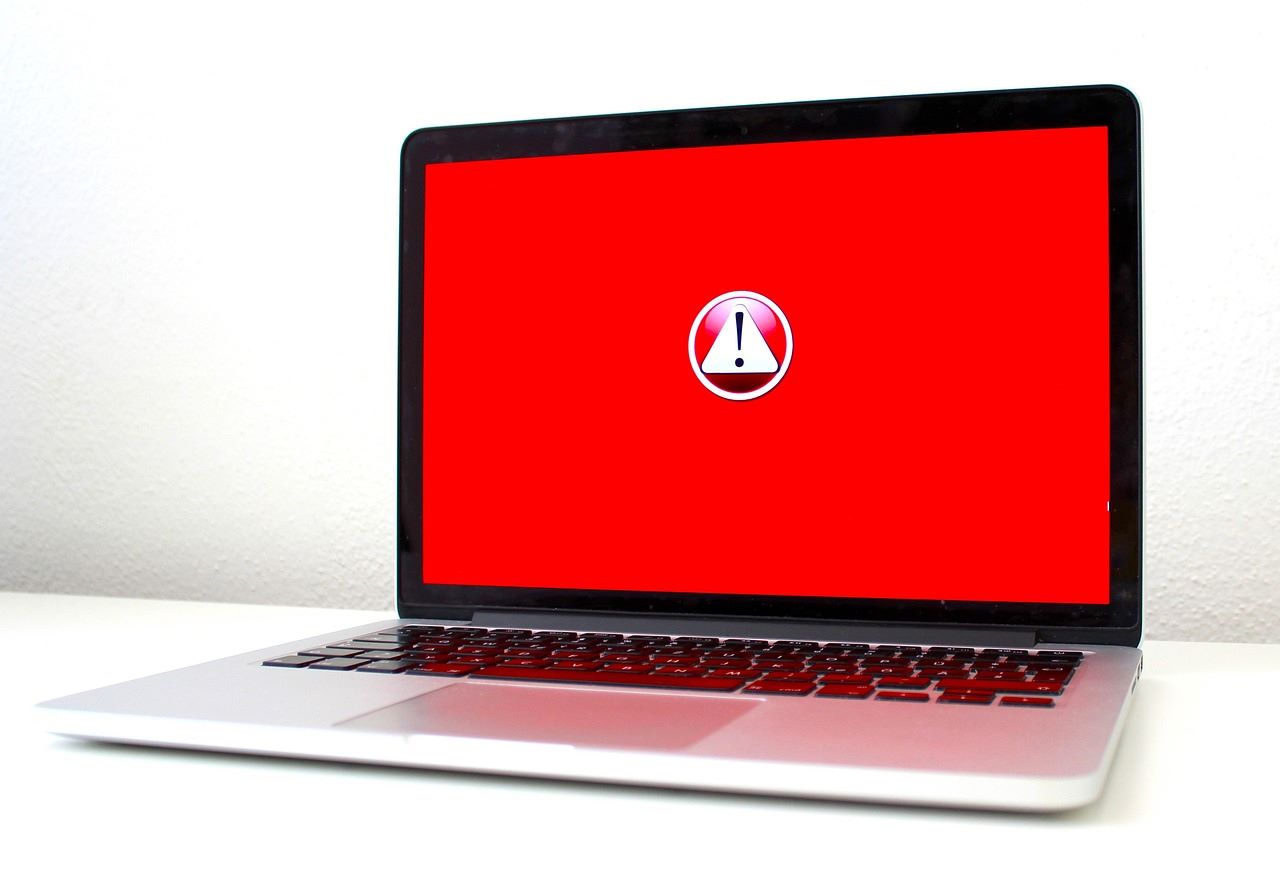 A laptop computer displaying a red error screen