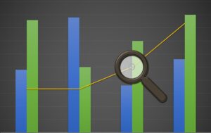 An image of a bar graph with a magnifying glass looking at part of it.