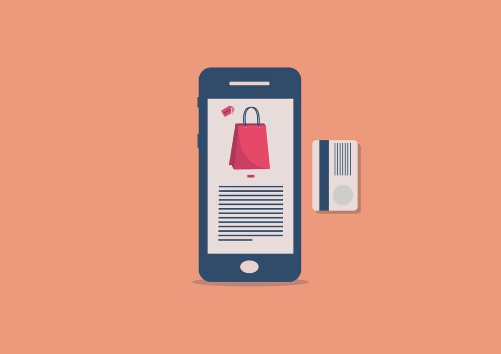 A phone visiting an online store, and there’s a credit or debit card beside it