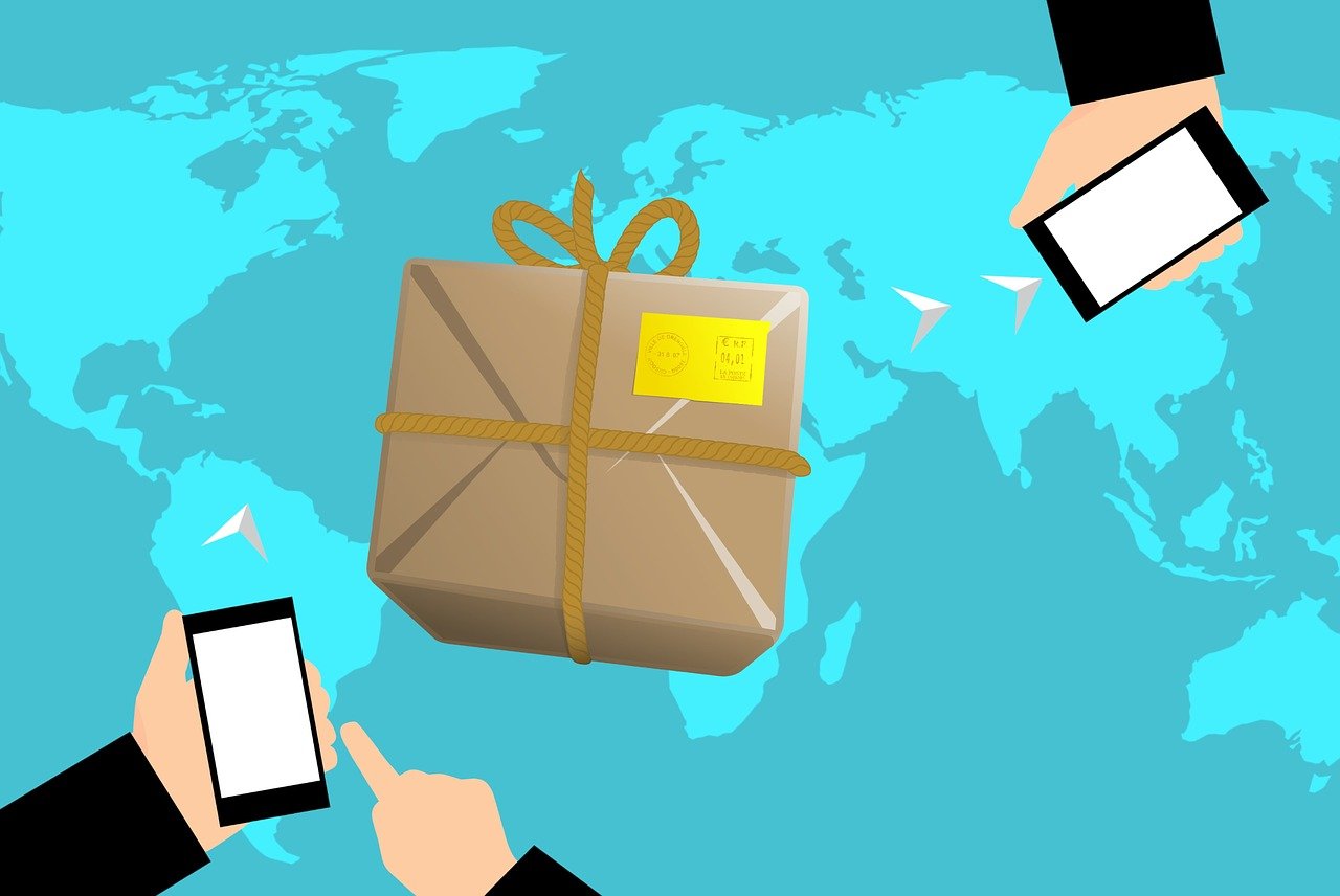 Two hands holding phones, with a package being sent from one person to another, and a world map as the background