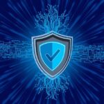 An image of a security shield with a checkmark on it, in front of lots of circuits