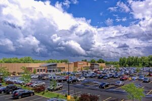 An image of a Walmart store and the parking lot in front of the store