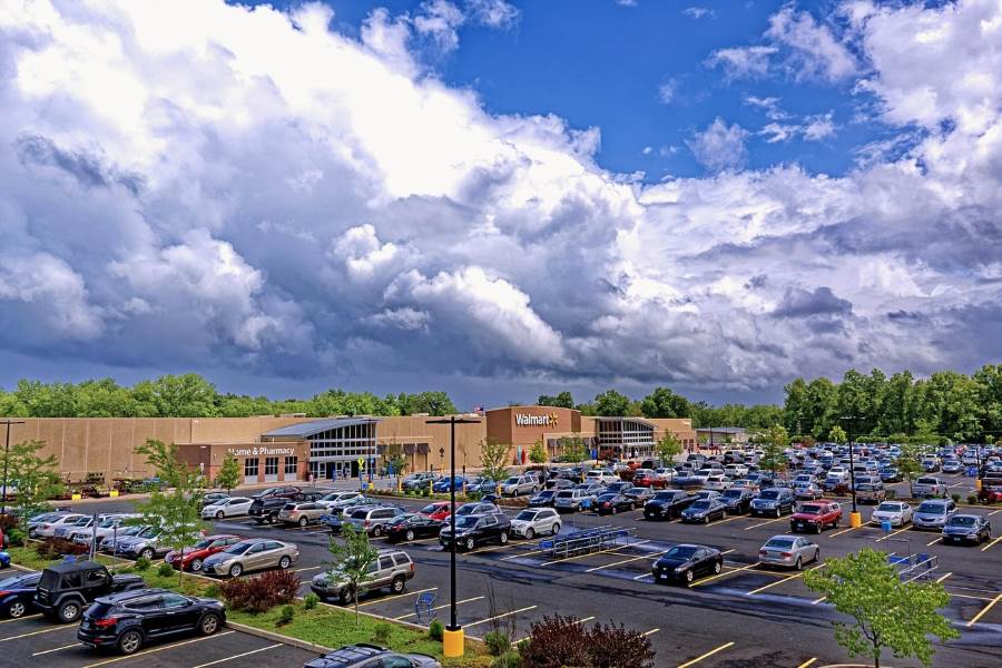 An image of a Walmart store and the parking lot in front of the store