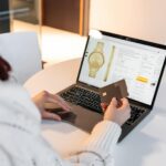 A woman on her laptop buying things online