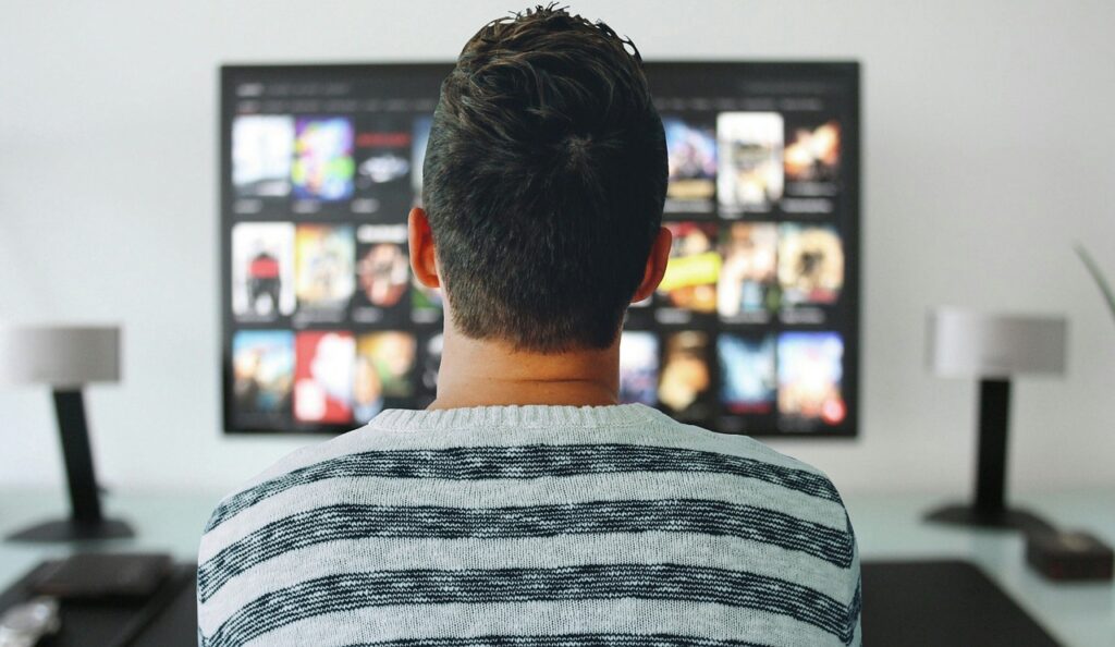 A person watching TV.