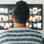 A person watching TV.