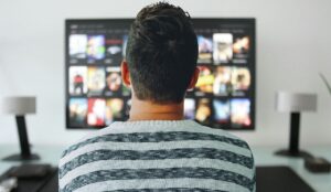 A person watching TV.