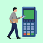 A person holding a box with a credit card in their other hand, walking towards a large card reader or terminal.