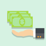 An image with some paper money above a person’s hand.