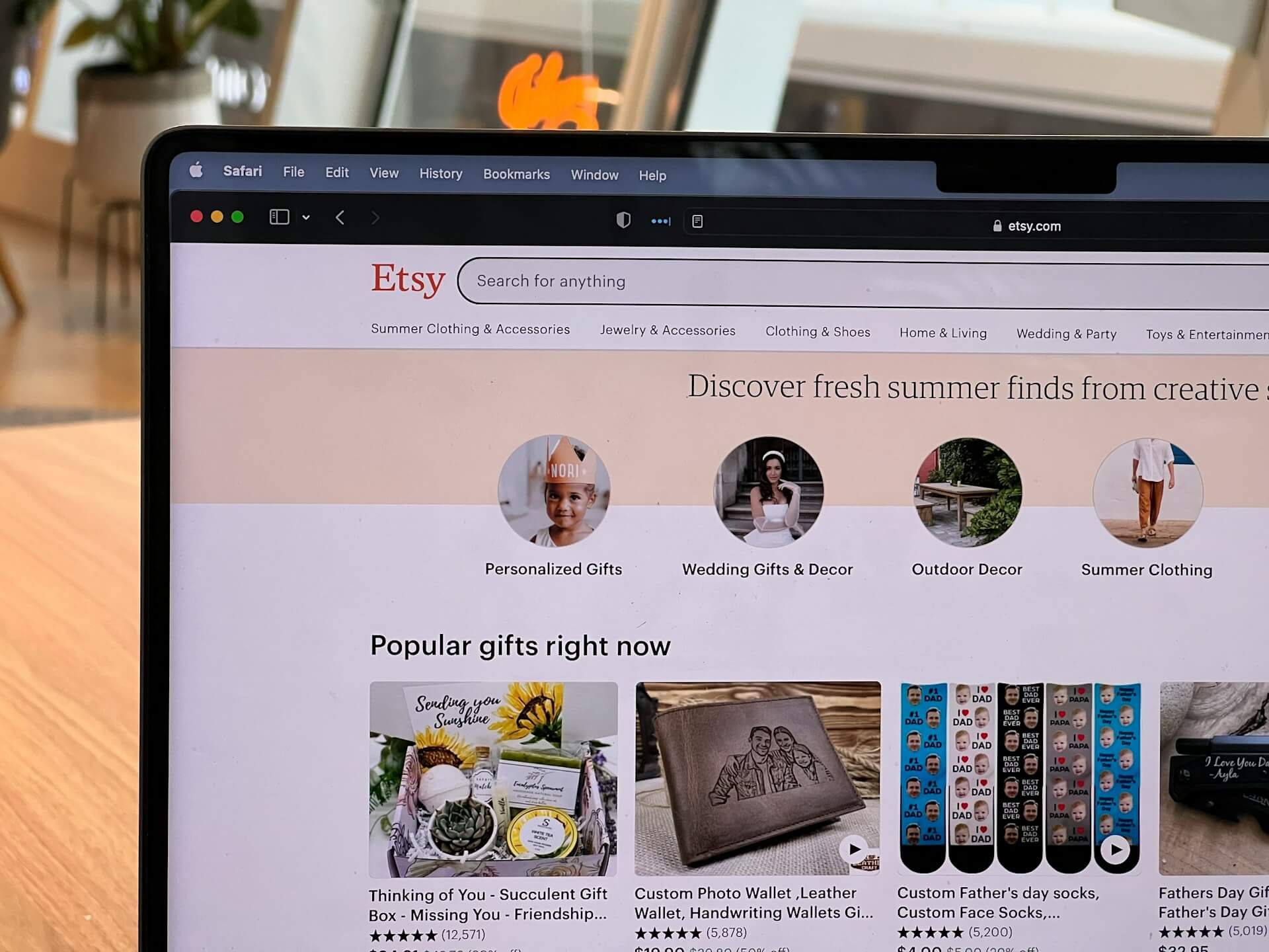 An image of Etsy website on a laptop screen