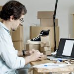 image of a guy working on his laptop and ecommerce platform
