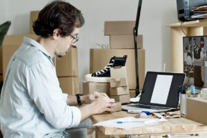 image of a guy working on his laptop and ecommerce platform