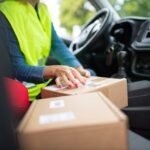 A postal worker delivering packages