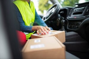 A postal worker delivering packages