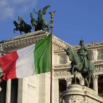 An image of the Italian flag in front of a building