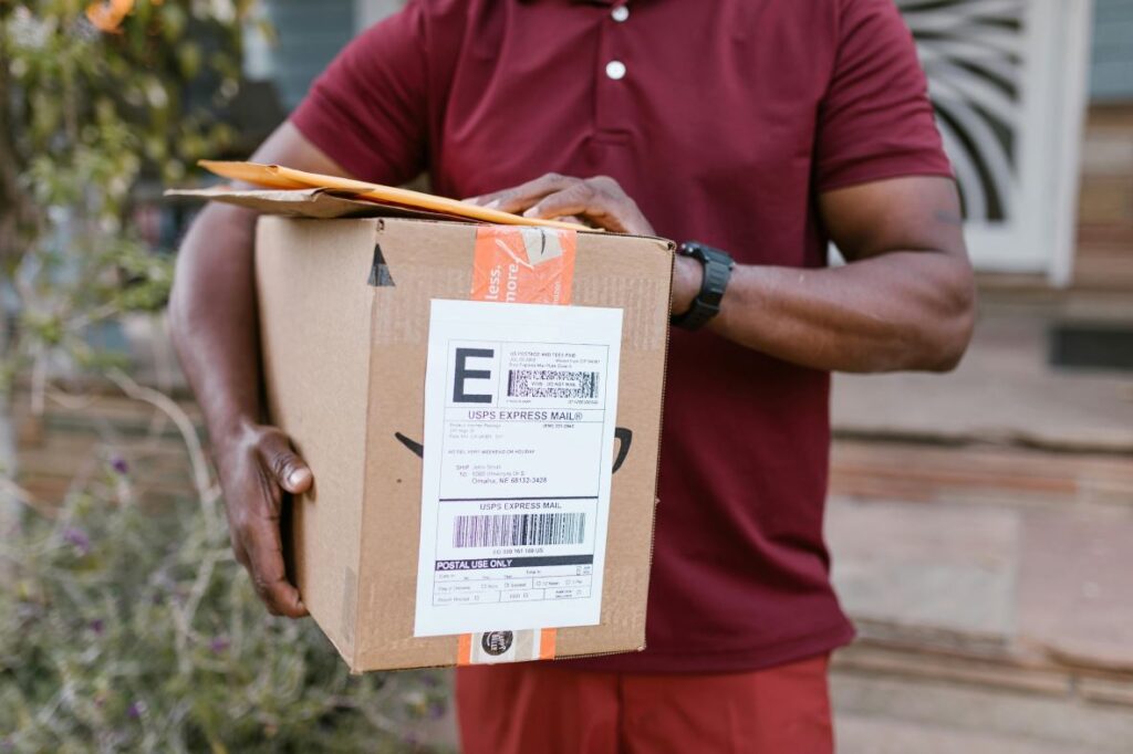 A person holding delivery packages