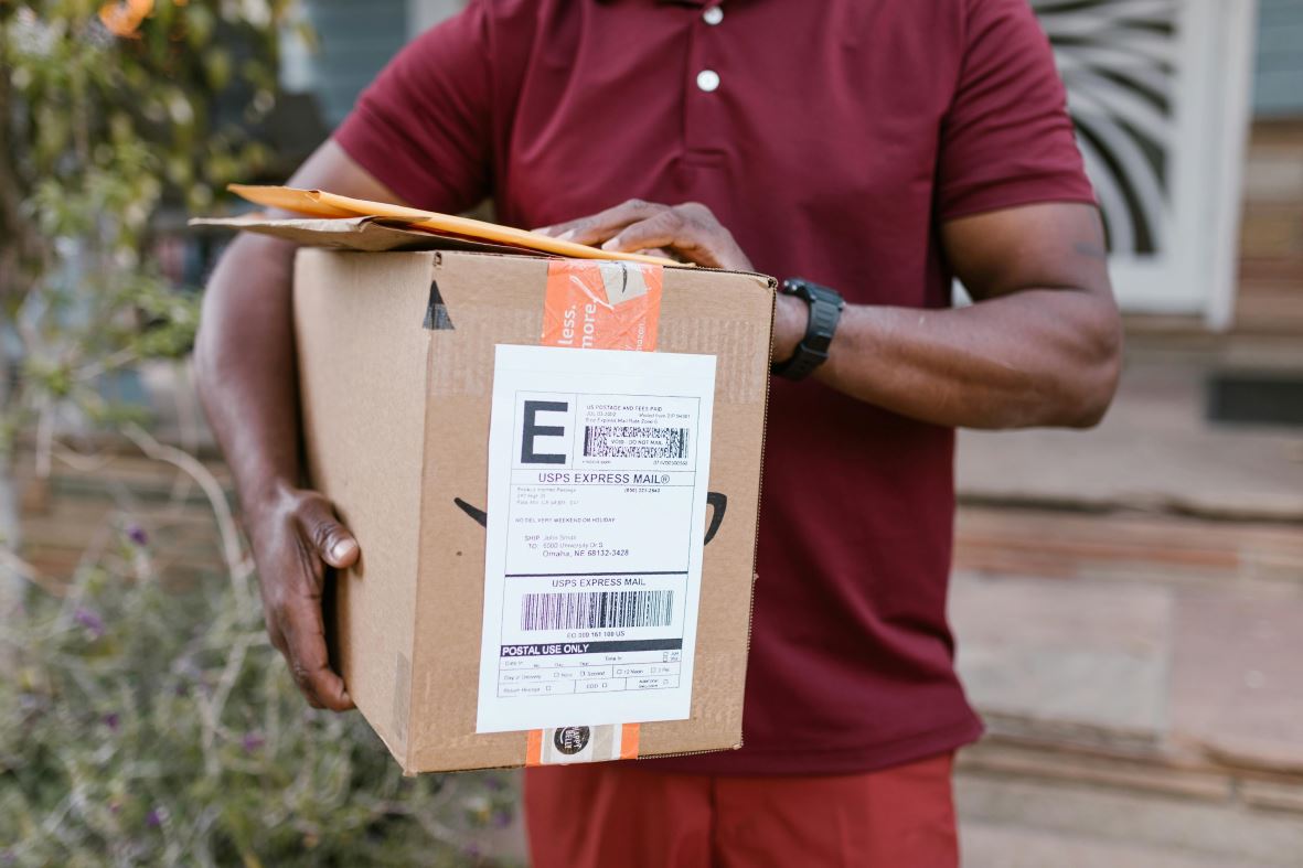 A person holding delivery packages