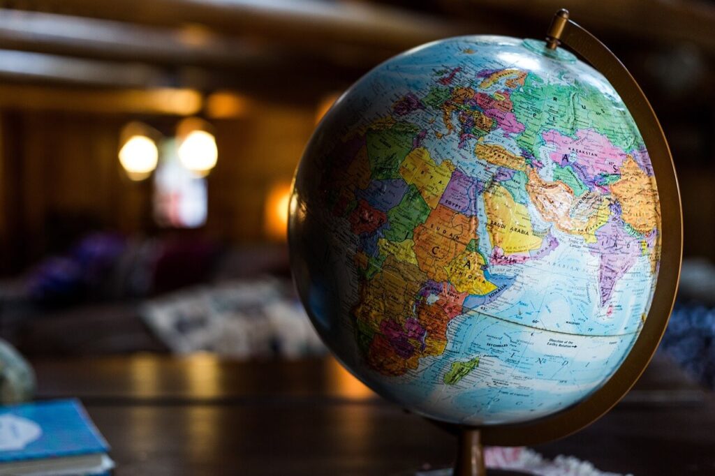 An image of a globe in a dark room.