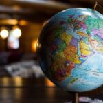 An image of a globe in a dark room.