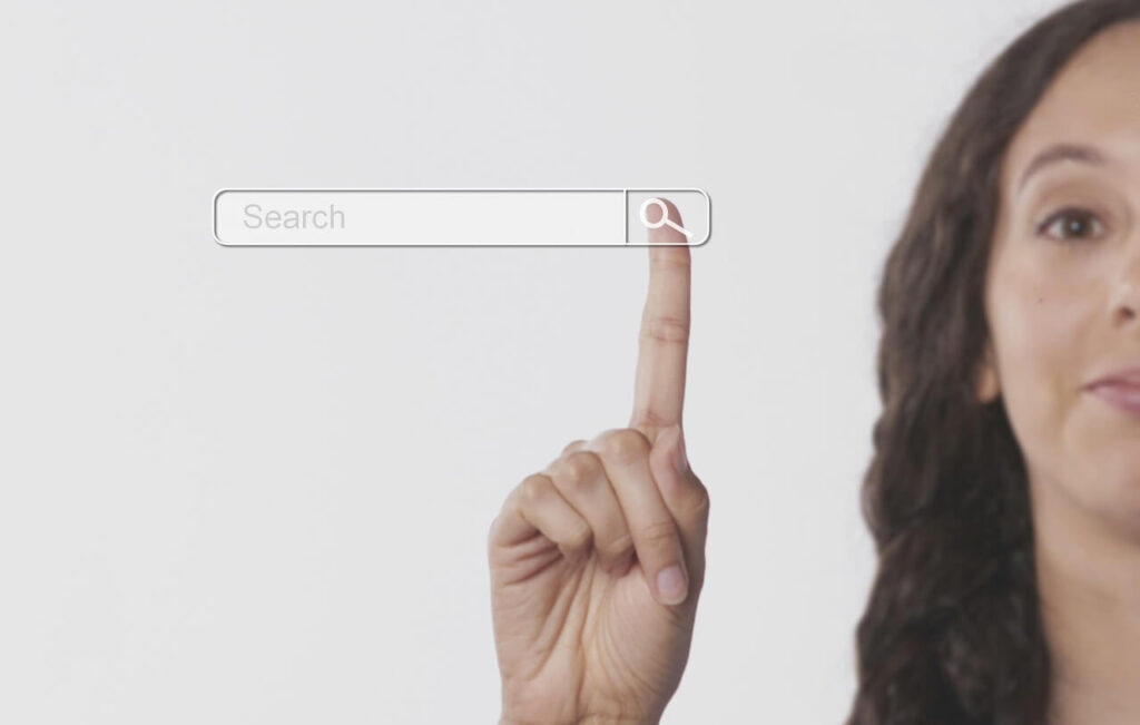 An image of a woman pressing the search bar