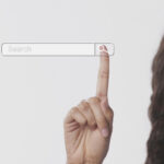 An image of a woman pressing the search bar