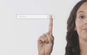An image of a woman pressing the search bar